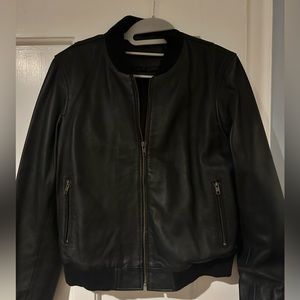 NWOT black leather bomber jacket. Size M. Soft leather. Never worn.